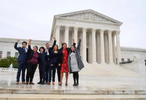 a group of people standing in front of United States Supreme Court Building: Carolina Fung Feng, third from left, Martin Batalla Vidal, fourth from left, and Eliana Fernandez, third from right join other DACA recipients heading into hear arguments before the U.S. Supreme Court on whether the 2017 Trump administration decision to end the Deferred Action for Childhood Arrivals program (DACA) is lawful on Nov. 12, 2019.