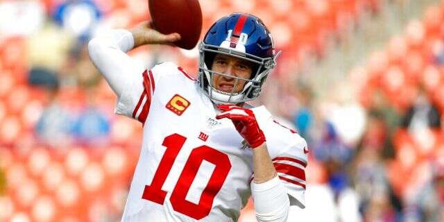 Dec. 22, 2019: New York Giants quarterback Eli Manning works out prior to an NFL football game against the Washington Redskins in Landover, Md. Manning, who led the Giants to two Super Bowls in a 16-year career that saw him set almost every team passing record, has retired. The Giants said Wednesday, Jan. 22, 2020 that Manning would formally announce his retirement on Friday. (AP Photo/Patrick Semansky)