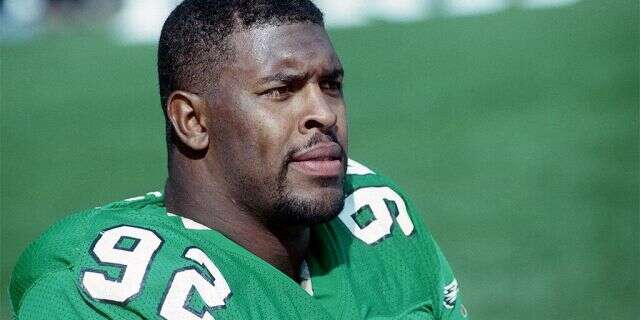 Defensive lineman Reggie White #92 of the Philadelphia Eagles looks on from the sideline during a game against the Cleveland Browns at Cleveland Municipal Stadium on October 16, 1988 in Cleveland, Ohio. The Browns defeated the Eagles 19-3. (Photo by George Gojkovich/Getty Images)