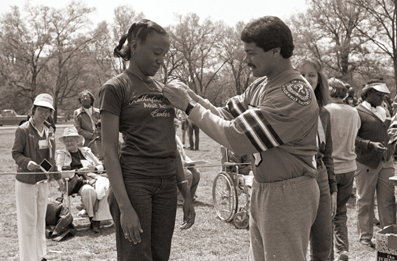 photo of a Special Olympian being awarded a medal